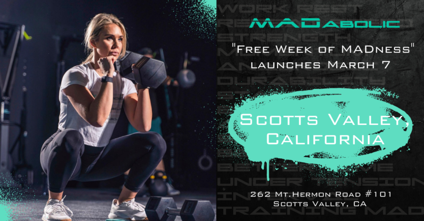 To the left, an athletic female performs a squat with a dumbbell in one hand. To the right, text says "MADabolic Scotts Valley is launching with a Free Week of MADness March 7" & includes the business address "626 Mt. Hermon Road, Suite 101, Scotts Valley